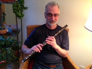 Dobbs' husband, Jesse Markow, with his grandfather's flute. 