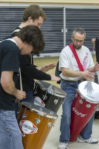 Professor Anthony Di Sanza, right, with members of the World Percussion Ensemble. Photo by Mike Anderson. 